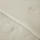 Close-up of a textured fabric with a neutral color palette