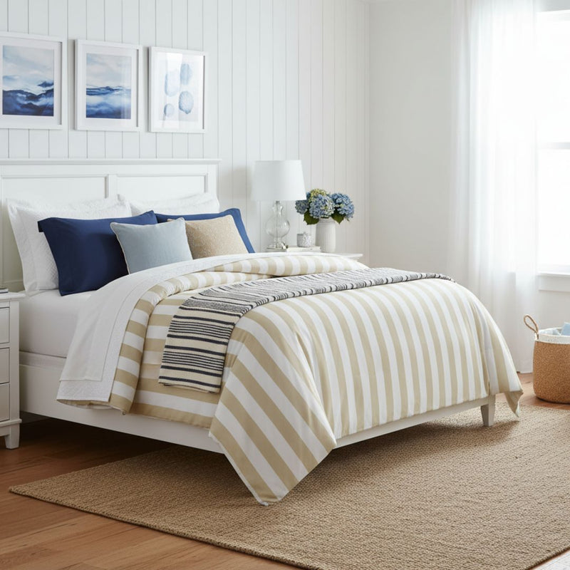 Bedroom with striped bedding and decorative pillows
