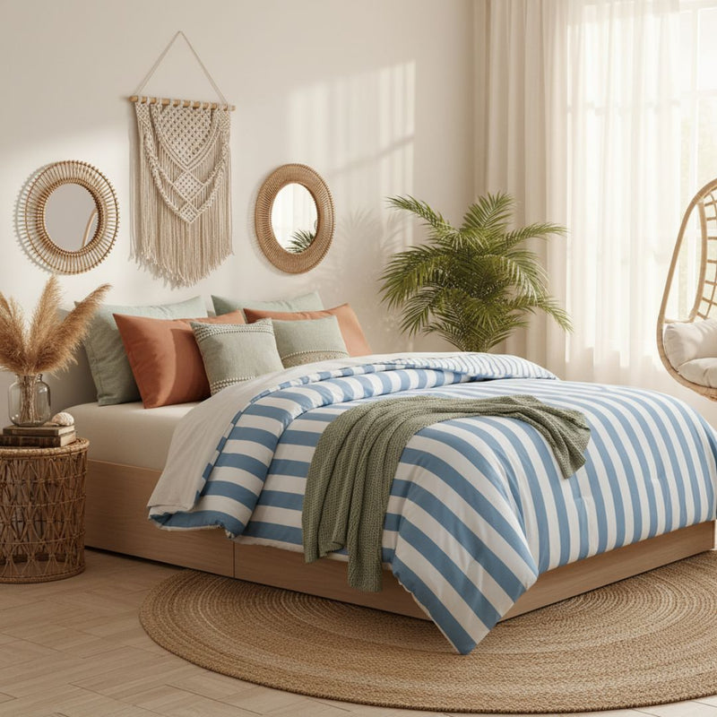 Cozy bedroom with striped bedding, decorative pillows, and wall art.