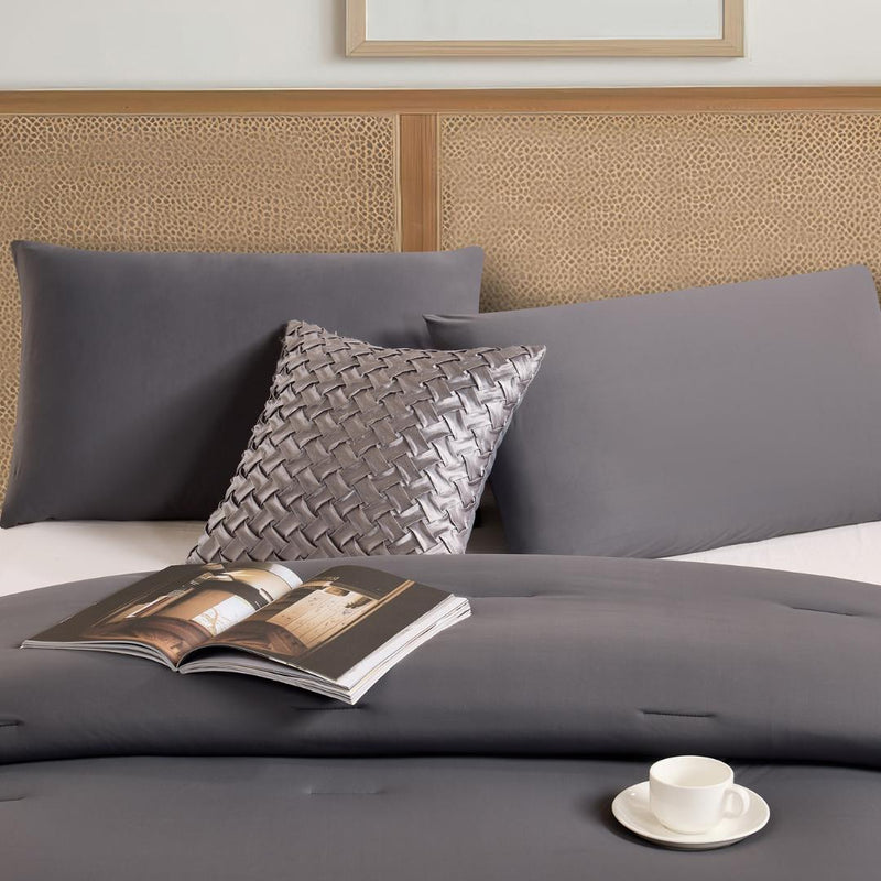 Lightweight cooling comforter with matching pillowcases in deep grey.
