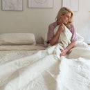 The Morgan and Reid Whispers Off White Coverlet Set by Morgan and Reid features a stylish, machine-washable polyester coverlet with a subtle floral pattern, matching pillows, and complements minimalist bedrooms with its elegant design.