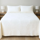 The Morgan and Reid Whispers Off White Coverlet Set by Morgan and Reid features a stylish, machine-washable polyester coverlet with a subtle floral pattern, matching pillows, and complements minimalist bedrooms with its elegant design.