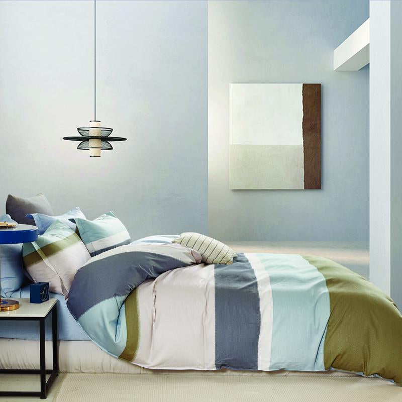 Bedroom featuring Odyssey Living Naples Cotton Quilt Cover Set in muted modern tones.