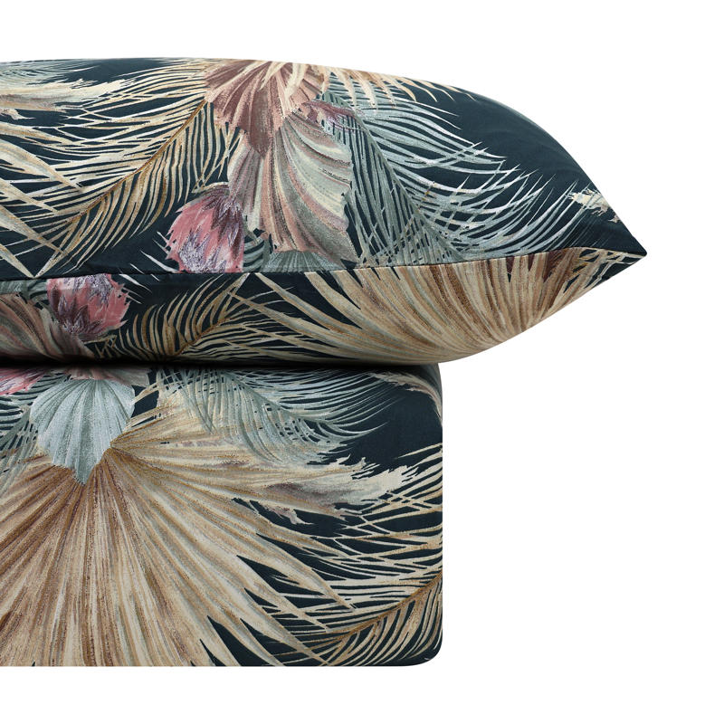 Seminyak Sunwashed Comforter Set in a warm-toned bedroom with woven pendant light.