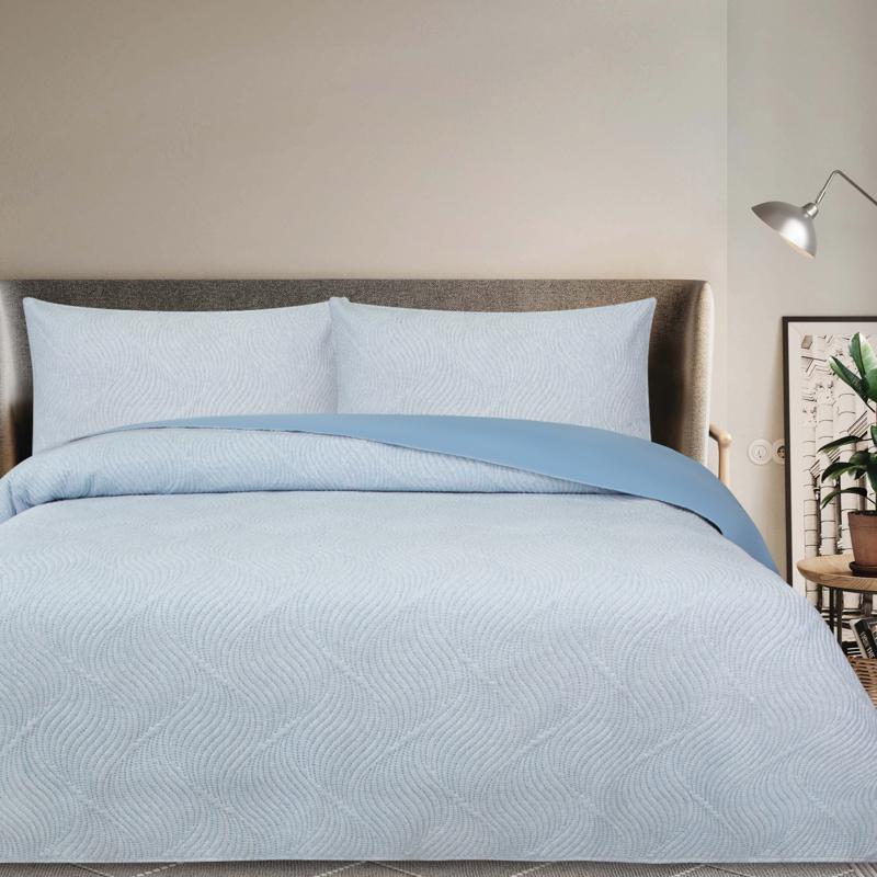 Modern bedroom featuring Odyssey Living Soho Comforter in calming blue tones.