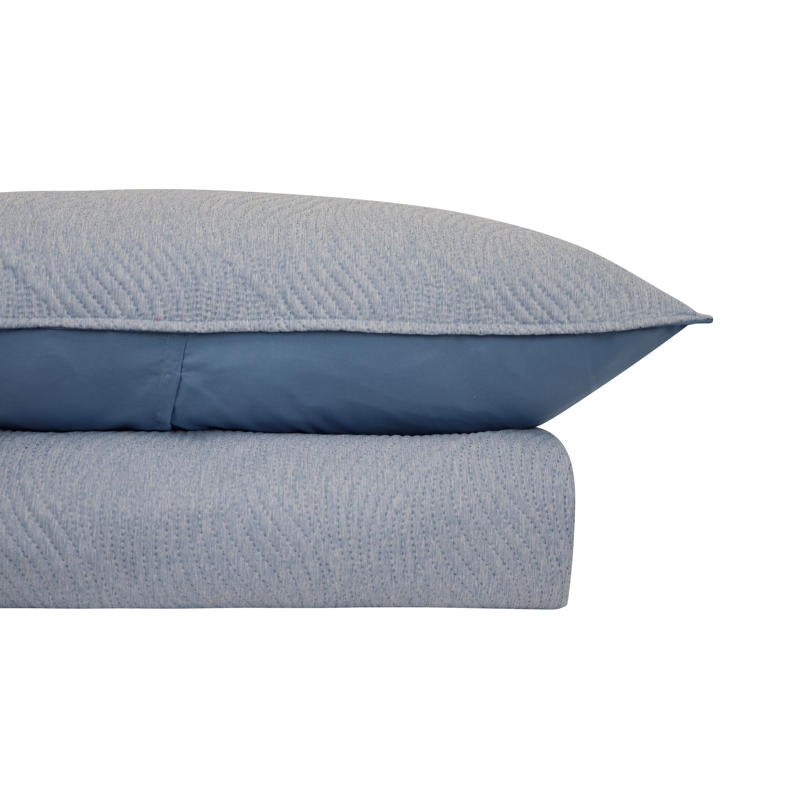 Modern bedroom featuring Soho Ultrasonic Blue Quilt Cover in soft blue tones.