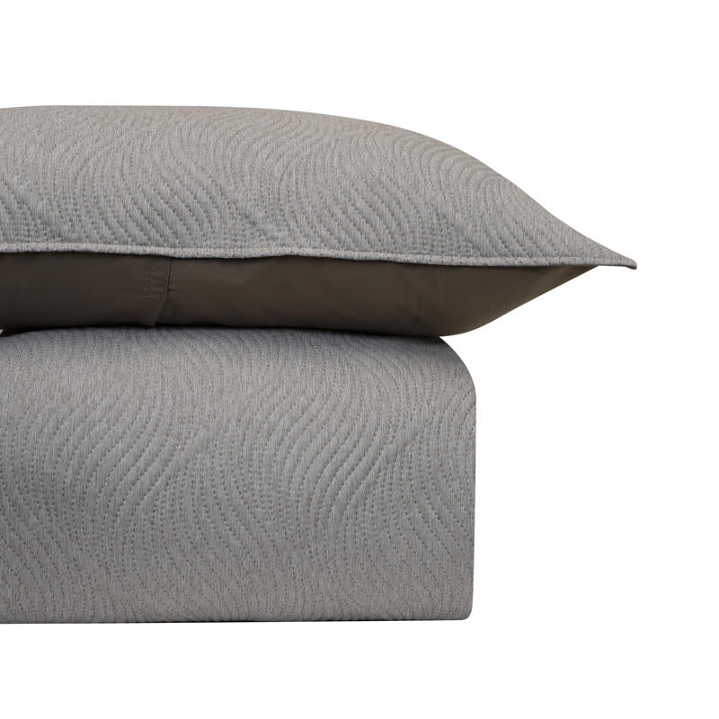 Neutral Odyssey Living Soho Comforter adding calm, contemporary style to any space.