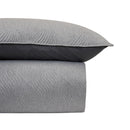 Modern bedroom featuring Odyssey Living Soho Silver Comforter with neutral decor.