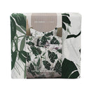 Odyssey Living Tahiti Cotton Quilt Cover Set styled on a bed with tropical leaf print.