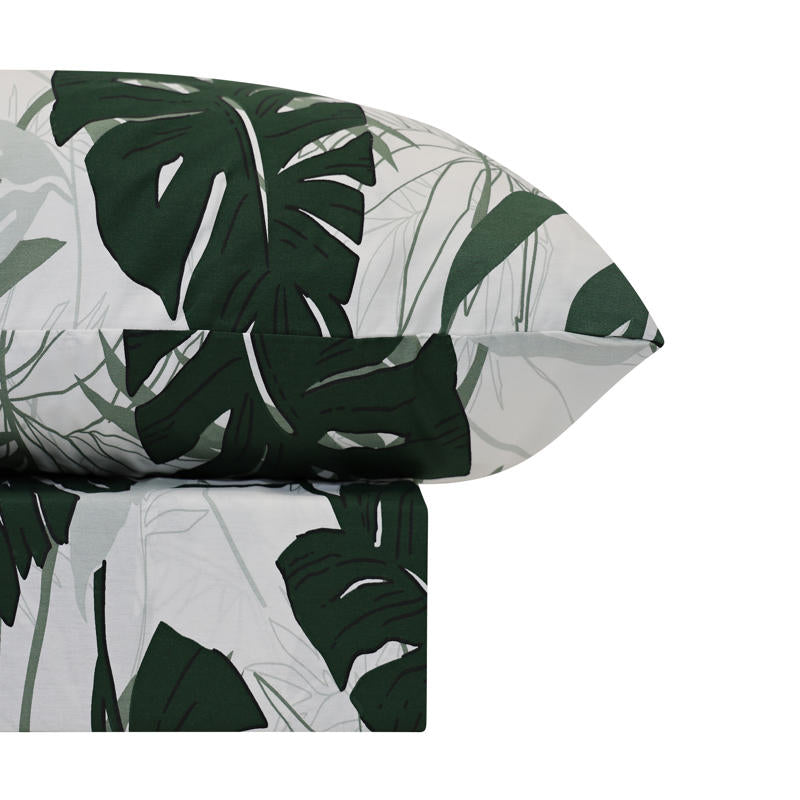 Odyssey Living Tahiti Cotton Quilt Cover Set styled on a bed with tropical leaf print.