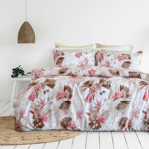 Tropical floral Odyssey Living comforter adding relaxed coastal charm to a white bedroom.