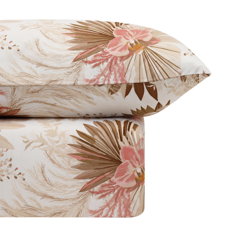 Tropical floral Odyssey Living comforter adding relaxed coastal charm to a white bedroom.