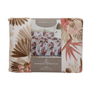 Tropical floral Odyssey Living comforter adding relaxed coastal charm to a white bedroom.