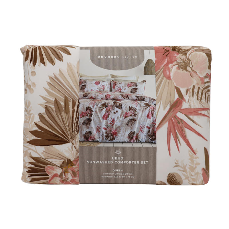 Tropical floral Odyssey Living comforter adding relaxed coastal charm to a white bedroom.