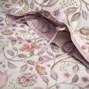 PIP Studio Garden of Dove Off-White Cushion with floral and dove design styled on bed.