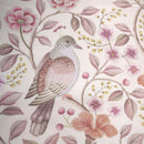 PIP Studio Garden of Dove Off-White Cushion with floral and dove design styled on bed.