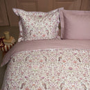 PIP Studio Garden of Dove Off-White Quilt Cover Set styled on a bed with soft floral detailing.
