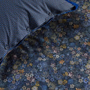 Decorative 35x60cm cushion in dark blue with elegant floral accents.