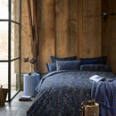 Decorative 35x60cm cushion in dark blue with elegant floral accents.