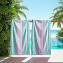 Renee Taylor Jacquard Velour Blue Cabana Beach Towel with blue, lilac, and pink stripes.