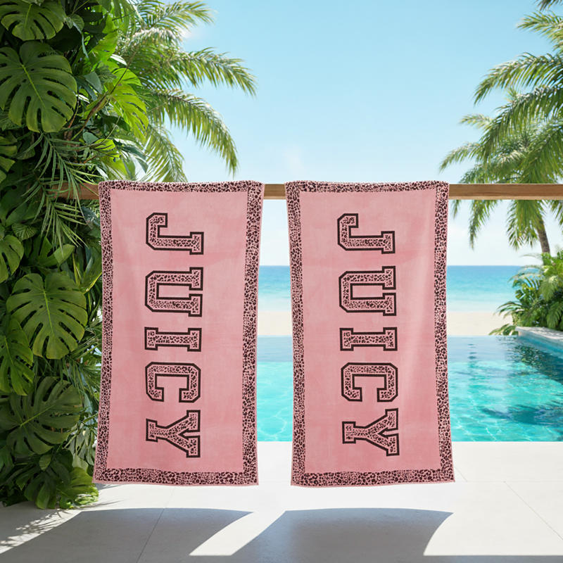 Renee Taylor Jacquard Velour Juicy Couture Beach Towel in blush pink with leopard trim.