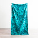 Renee Taylor Jacquard Velour Leaf Beach Towel with tropical teal foliage design.