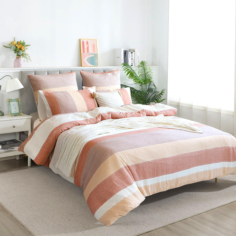 Renee Taylor Bayley Cotton Quilt Cover Set styled with neutral throw and natural decor.