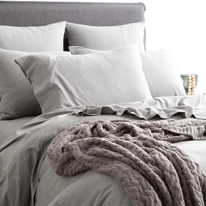 Styled bed featuring Renee Taylor Charcoal European Pillowcase with matching jersey bedding.