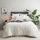 Styled bed featuring Renee Taylor Ecru European Pillowcase with matching organic cotton jersey bedding.