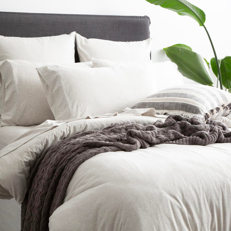 Styled bed featuring Renee Taylor Ecru European Pillowcase with matching organic cotton jersey bedding.