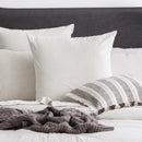 Styled bed featuring Renee Taylor Ecru European Pillowcase with matching organic cotton jersey bedding.