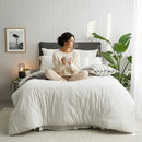 Styled bed featuring Renee Taylor Ecru European Pillowcase with matching organic cotton jersey bedding.