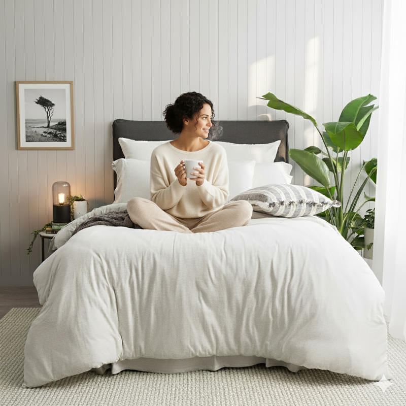 Styled bed featuring Renee Taylor Ecru European Pillowcase with matching organic cotton jersey bedding.