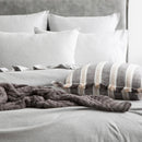 Styled bed featuring Renee Taylor Grey Marle European Pillowcase with matching jersey bedding.