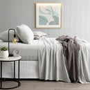 Pillowcase set in light grey marle paired with matching sheet set and neutral throw.