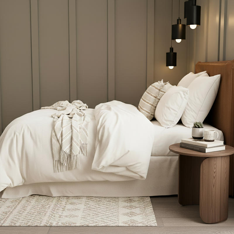 Cosy bedroom scene featuring the Renee Taylor Oatmeal Quilt Cover Set with matching pillowcases.