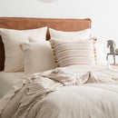 Cosy bedroom scene featuring the Renee Taylor Oatmeal Quilt Cover Set with matching pillowcases.