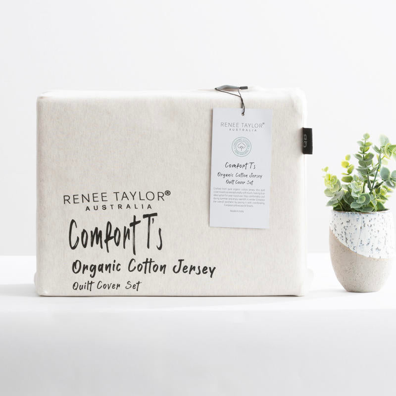 Cosy bedroom scene featuring the Renee Taylor Oatmeal Quilt Cover Set with matching pillowcases.