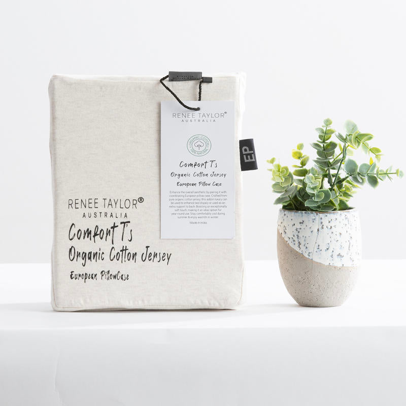 Cosy bedroom scene featuring the Renee Taylor Oatmeal Quilt Cover Set with matching pillowcases.