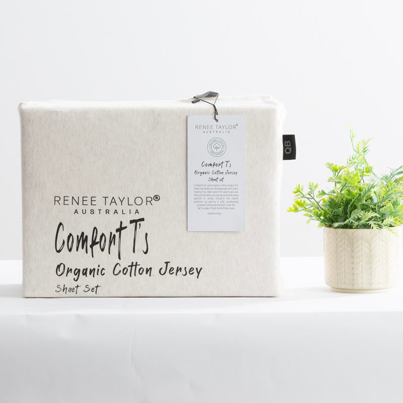 Oatmeal organic cotton jersey pillowcase set styled on a soft, neutral bed.
