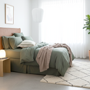 Styled bedroom featuring Renee Taylor Olive European Pillowcase with matching jersey bedding.