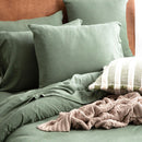 Styled bedroom featuring Renee Taylor Olive European Pillowcase with matching jersey bedding.