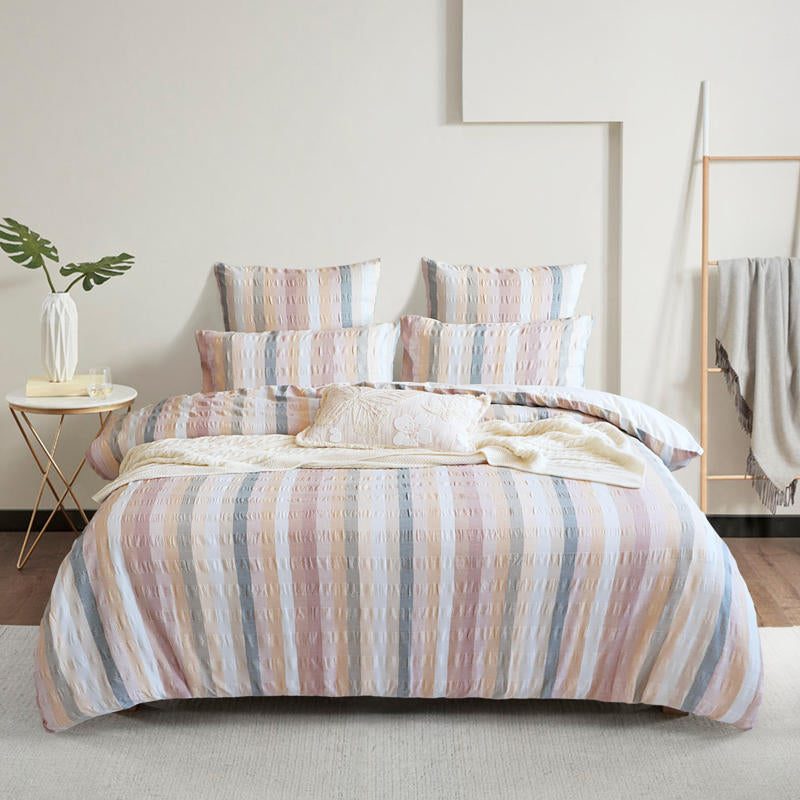 Full bedroom styled with Renee Taylor Layla 100% Cotton Quilt Cover Set in soft pastel stripes.