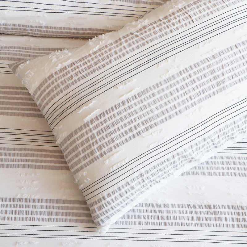 Renee Taylor Lenone Quilt Cover Set paired with light timber furniture for a relaxed, modern look.