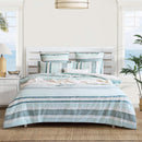 Renee Taylor Montego Quilt Cover Set styled in a coastal bedroom with ocean views.