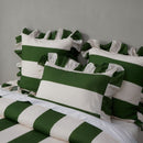 Bold green and white striped quilt cover with ruffle edge detail.