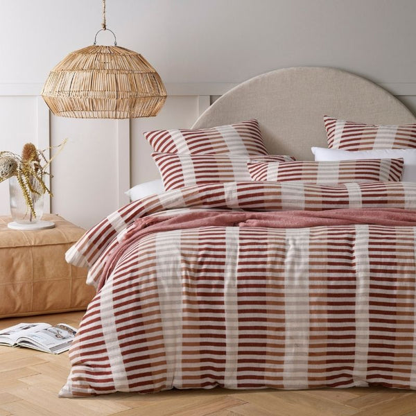 Cotton jacquard quilt cover set in red and neutral tones bedroom styling.