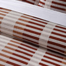 Cotton jacquard quilt cover set in red and neutral tones bedroom styling.