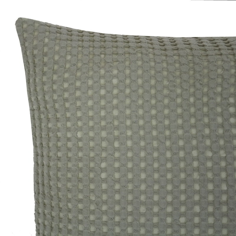 alt="Close-up view of a quare cushion in two-tone sage waffle fabric"