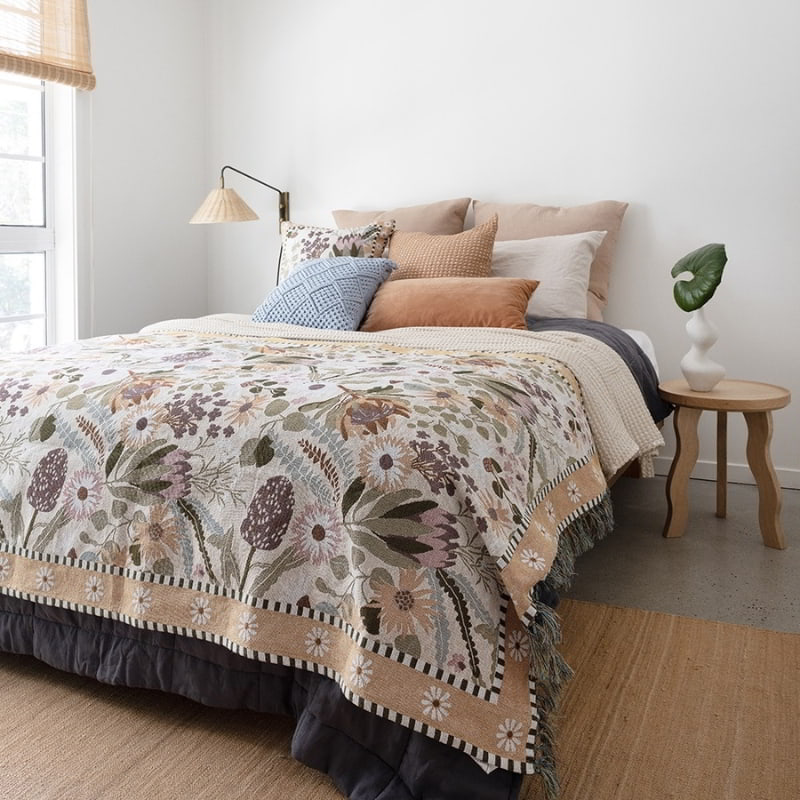 alt="Featuring a square cushion in two-tone light and dark brown waffle fabric in a earthy theme bedroom"